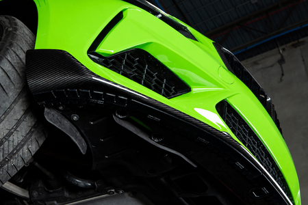 Acexxon lip protector installed beneath a carbon fiber front lip