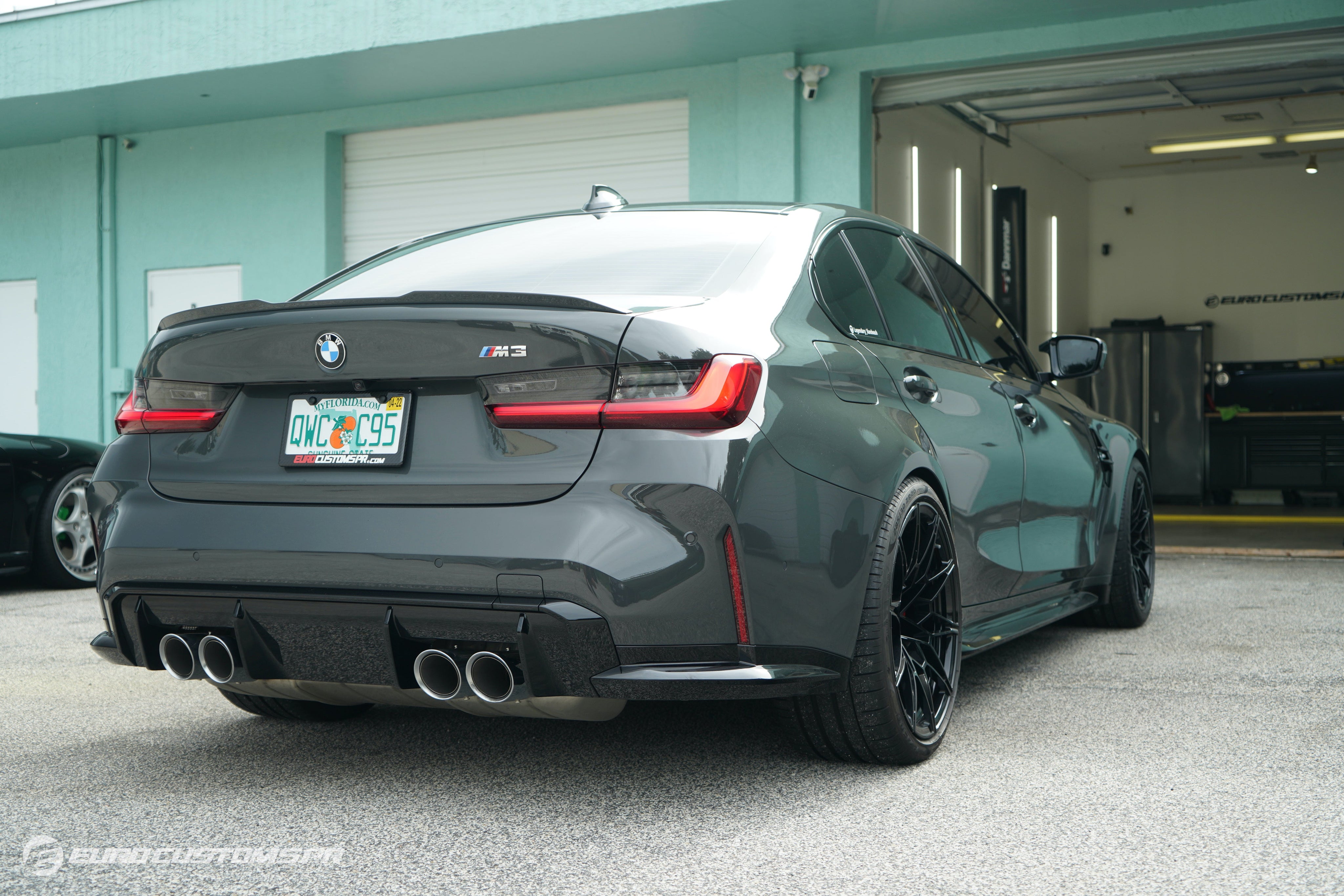 BMW G80 M3 with H&R Sport Springs installed, rear three-quarter view