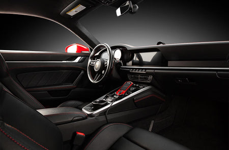 COBB Accessport V3 installed in a Porsche 911 992.1 interior, shown with red faceplate