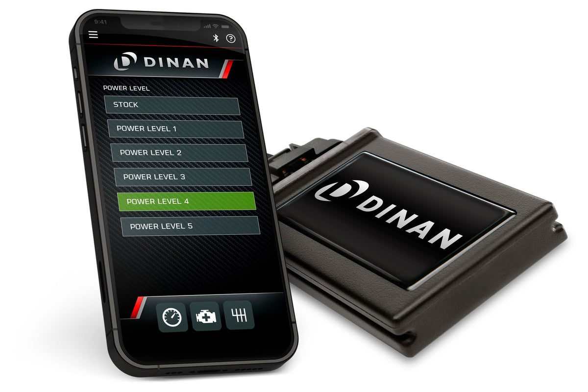 Dinan D440-0200 S58 PCU tuning module shown beside its smartphone app interface