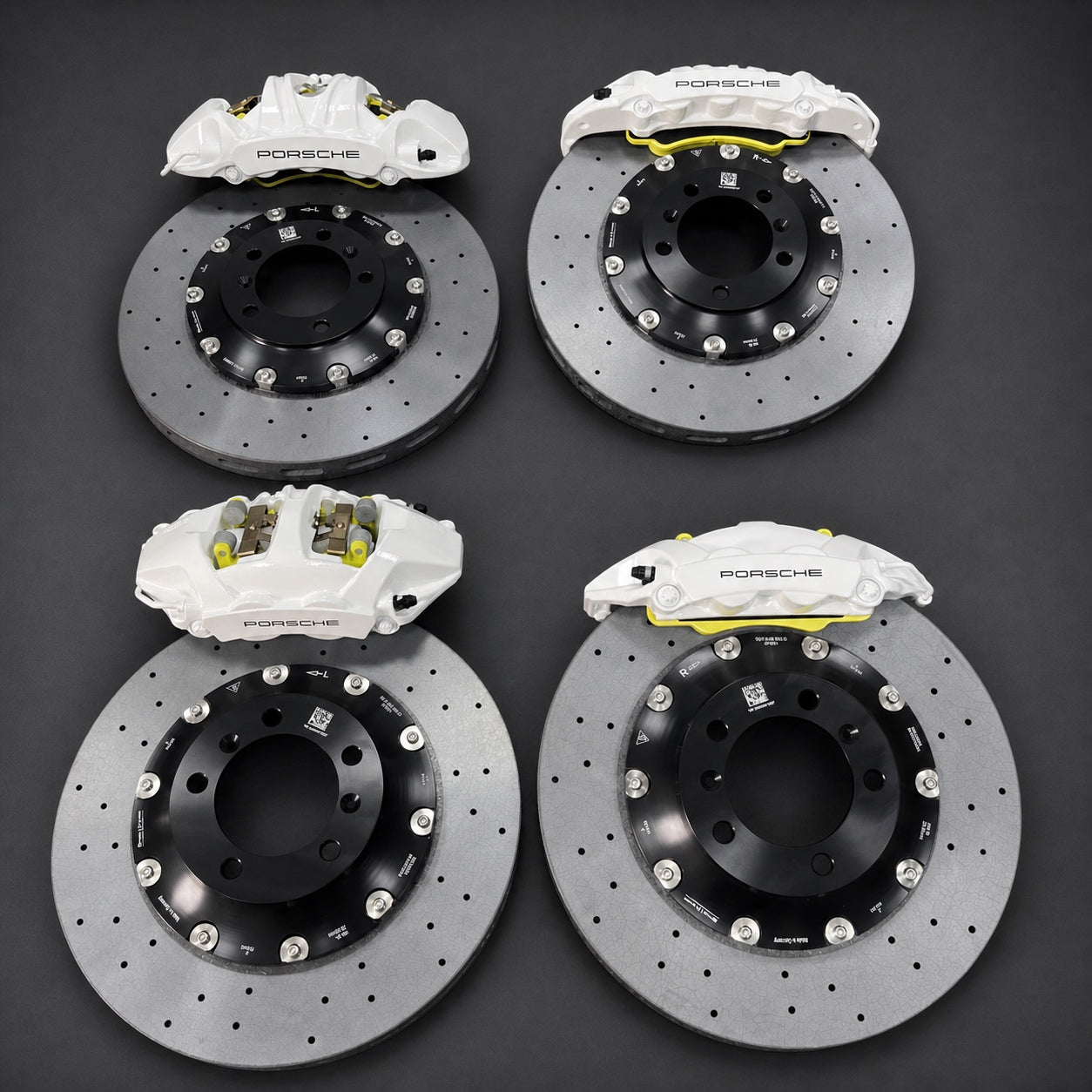 Four carbon ceramic brake assemblies arranged as a complete ECPR four-corner performance system