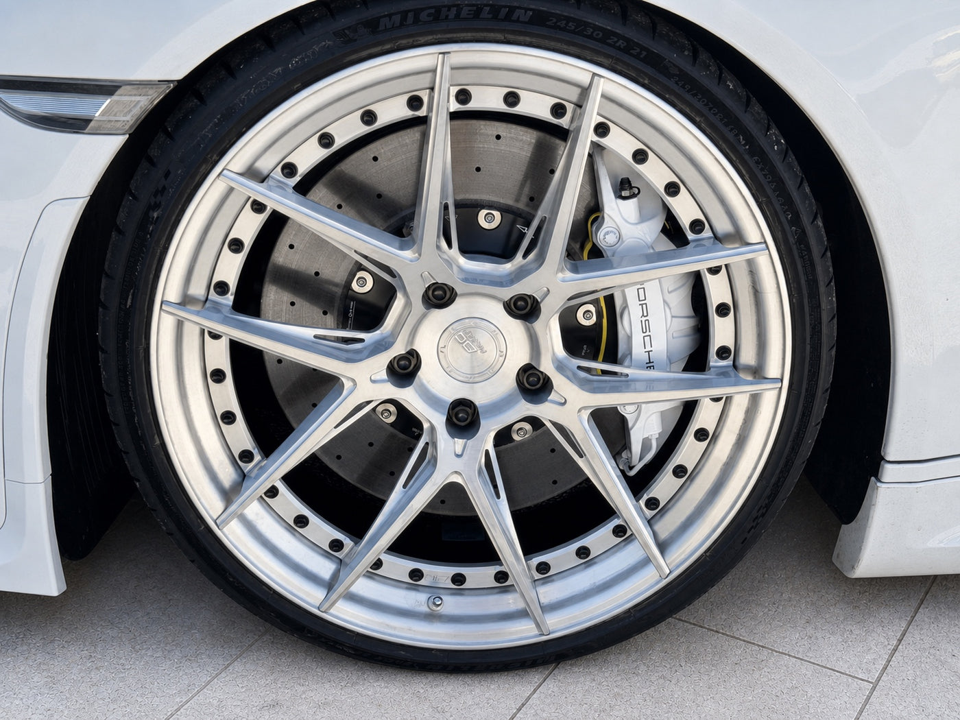 Custom wheel, performance caliper and carbon-ceramic brake system installed on a Porsche 911 991.2
