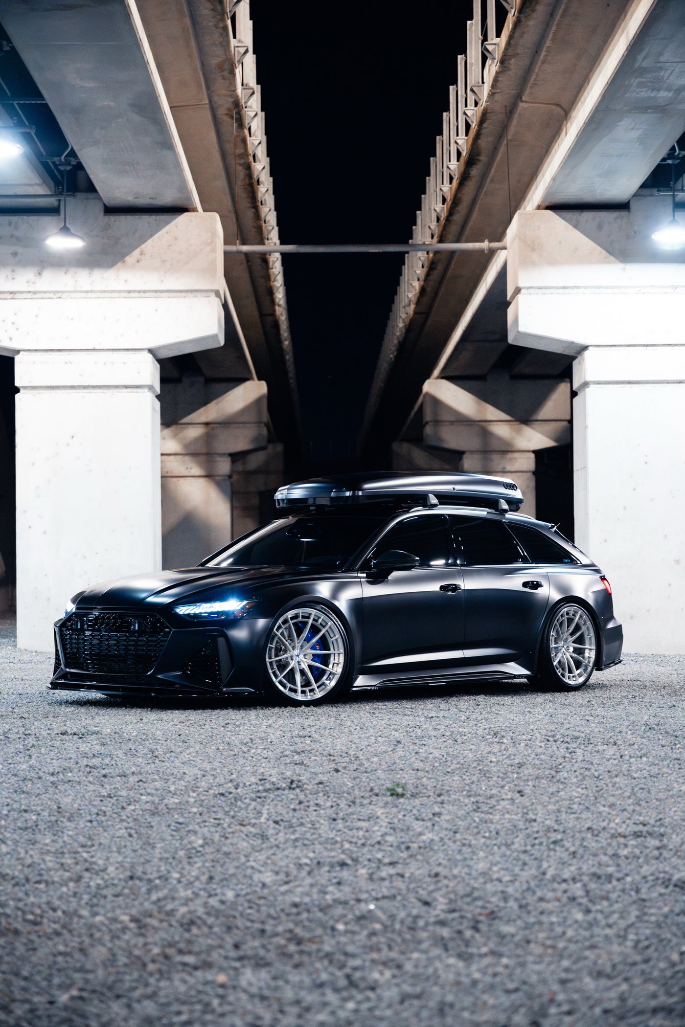Audi RS6 signature build by EuroCustomsPR photographed beneath concrete architectural columns