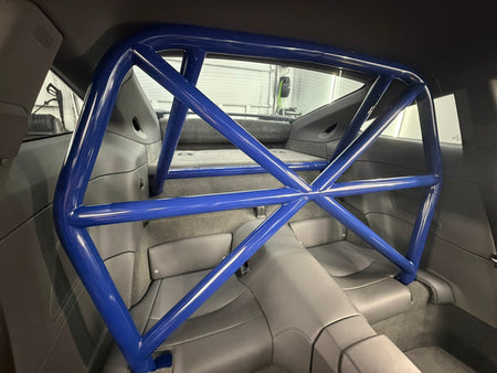 Gentian Blue CMS Performance roll bar installed in a Porsche 992 interior