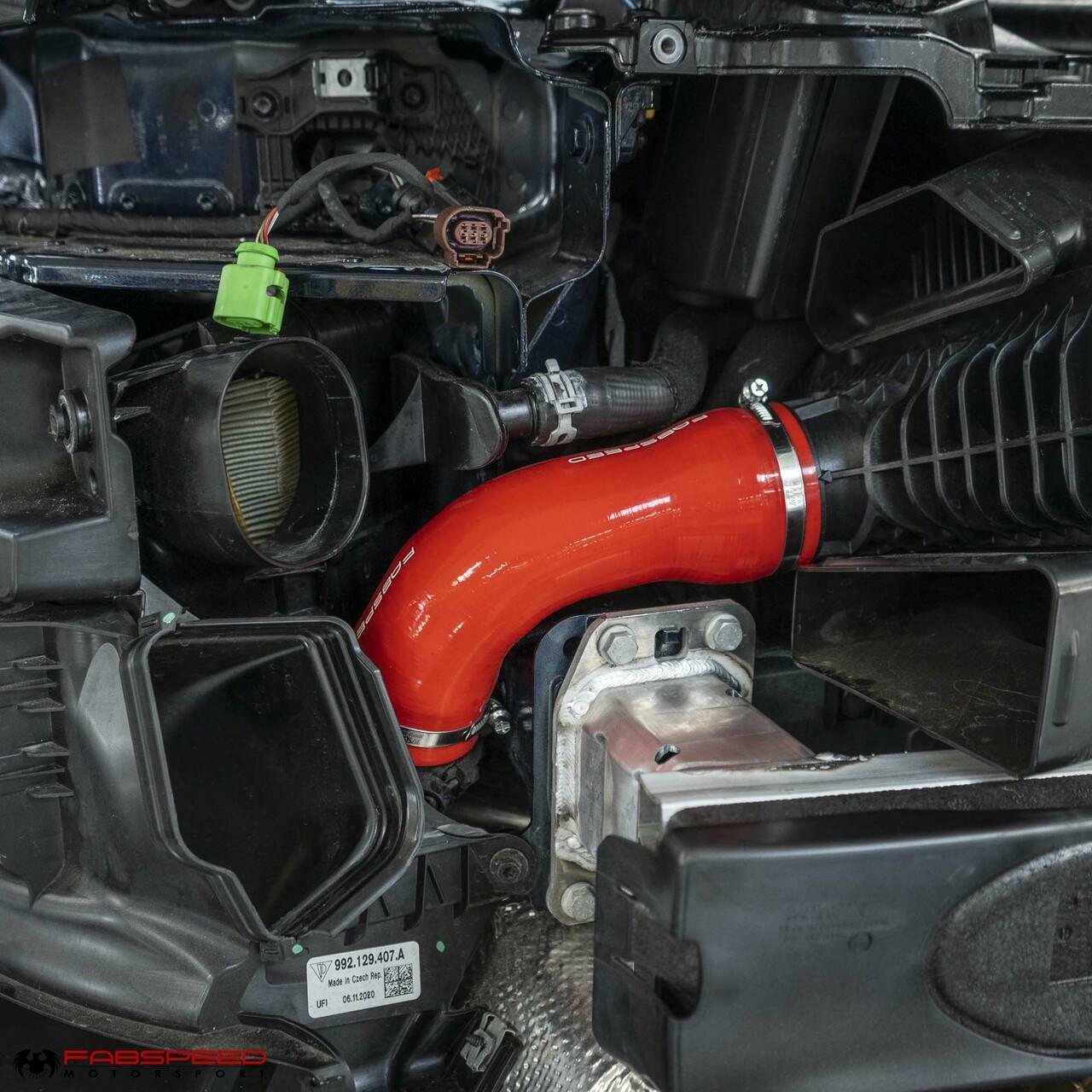Fabspeed red silicone boost hose installed on Porsche 992 Turbo